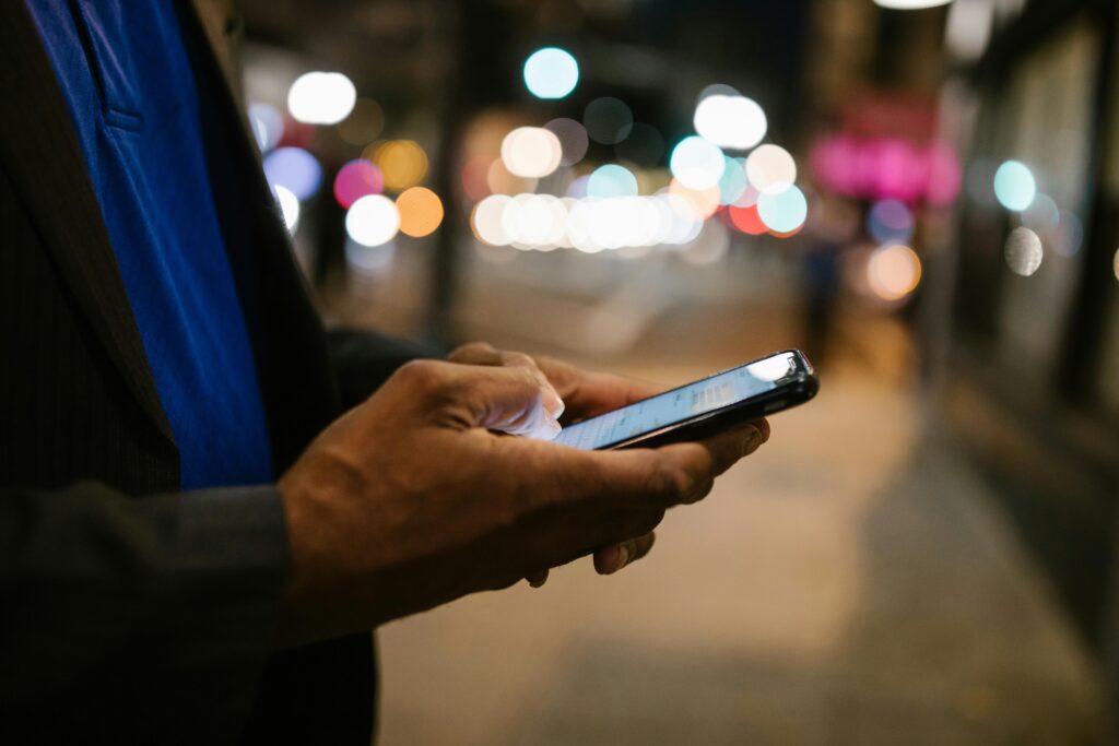 Person Holding Black Smartphone